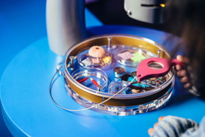A lense is used to examine a butterfly at great detail
