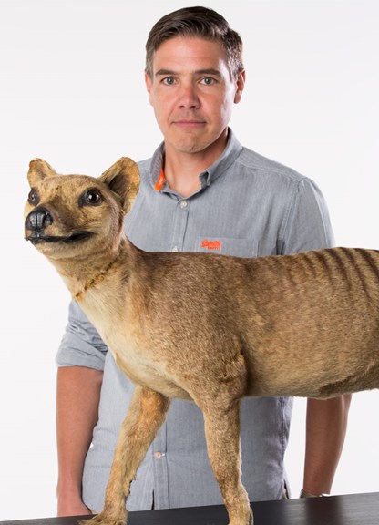 Portrait of University of Melbourne's Professor Andrew Pask with the thylacine mount. 