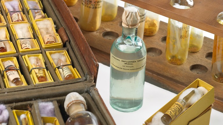 Group of glass vials on bench