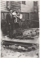 Setsutaro Hasegawa, son Leo, and grandchild Leonard in their backyard, Geelong, circa 1933