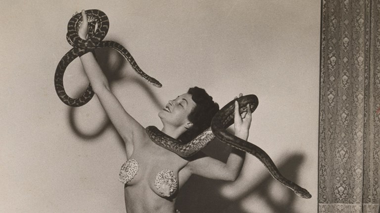 Woman preforming with a python