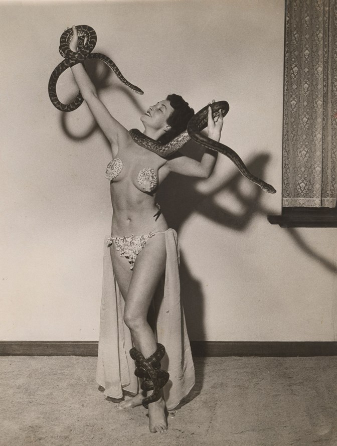 Woman preforming with a python