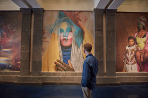 Person viewing large scale photographic prints