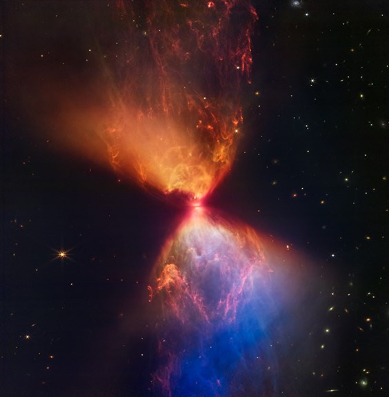 An hourglass-shaped formation of colouful cosmic gas and dust