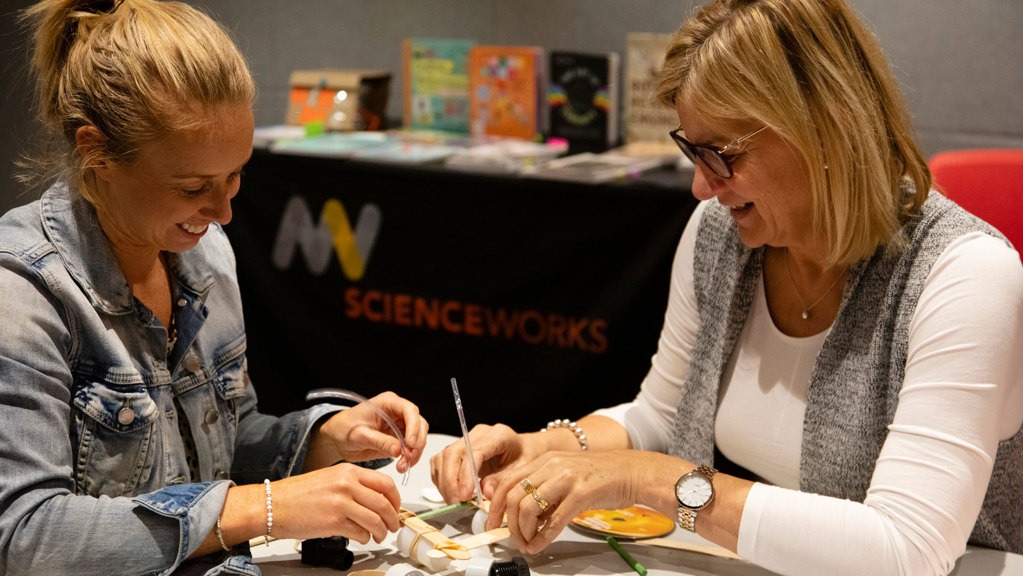 Two women participating in a STEM workshop.  