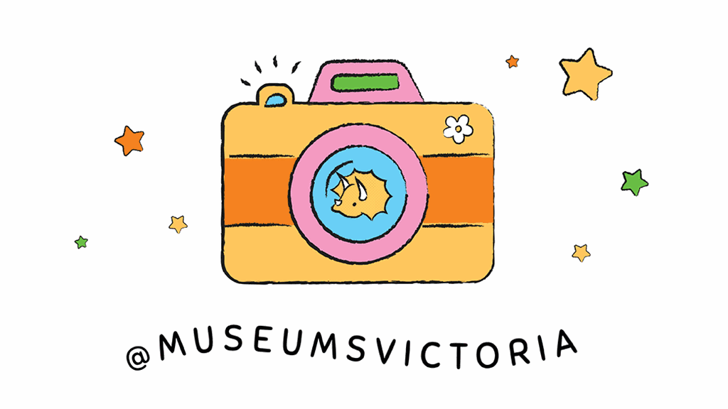 A camera with a triceratops on the lense next to @museumsvictoria tag.