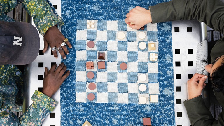 Overhead shot of two men playing chess