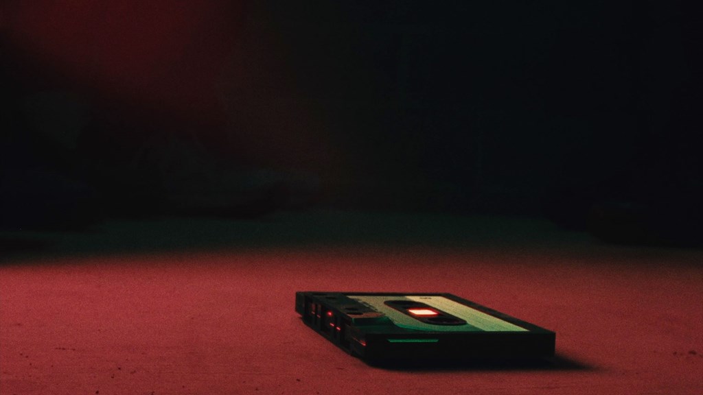A cassette tape lying on the floor.
