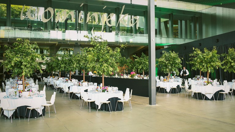 Tables set for a function in the Melbourne Museum foyer