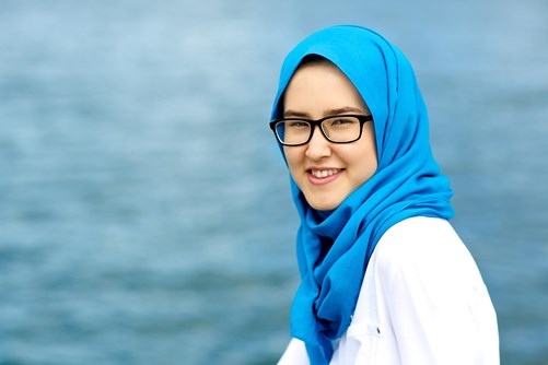 Woman with glasses and blue head scarf