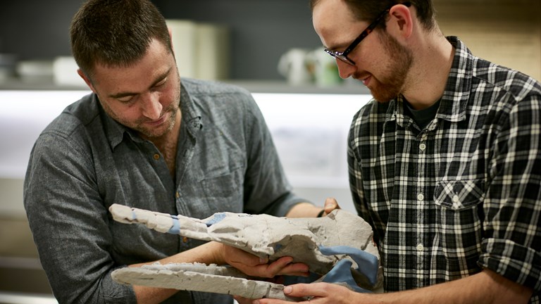 Erich Fitzgerald and Tim Zieglar with 3D model of Alfred's skull.