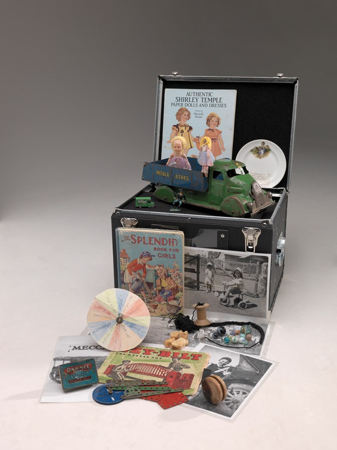 Various objects and props relating to childhood games used in reminiscing kit outreach programs
