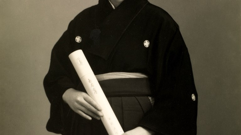 Woman in a formal crested kimono