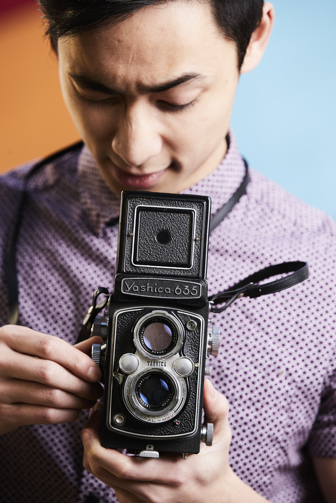 Man holding an old camera