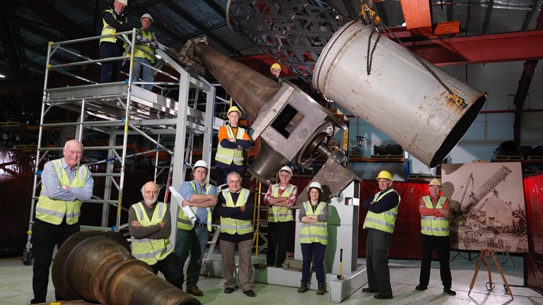 Volunteers and staff with components of the Great Melbourne Telescope set-up at Moreland Annexe.