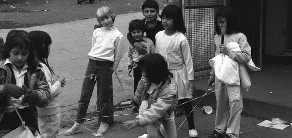 Photograph - children playing an elastics game in the street