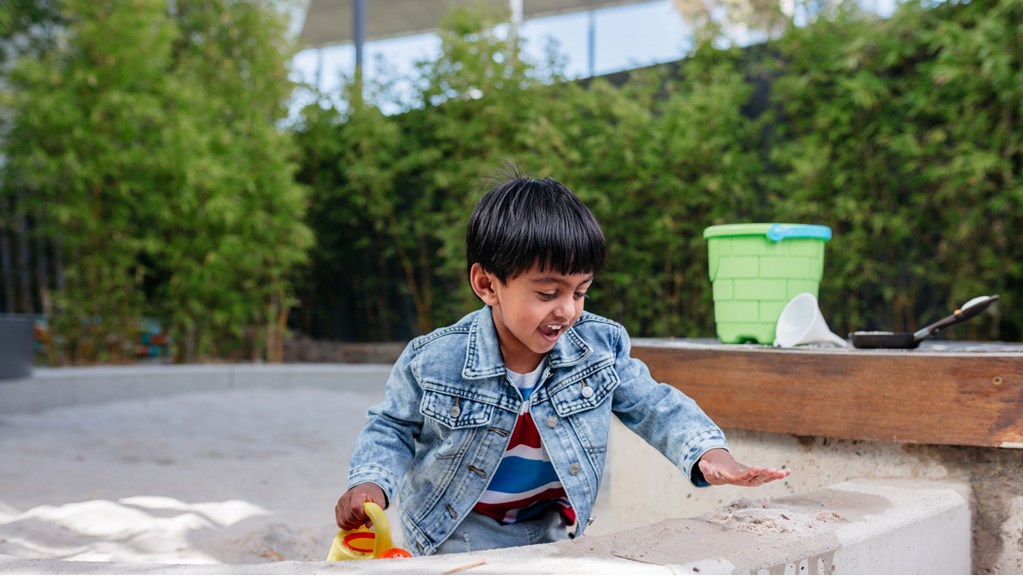 Child playing in a sandpit