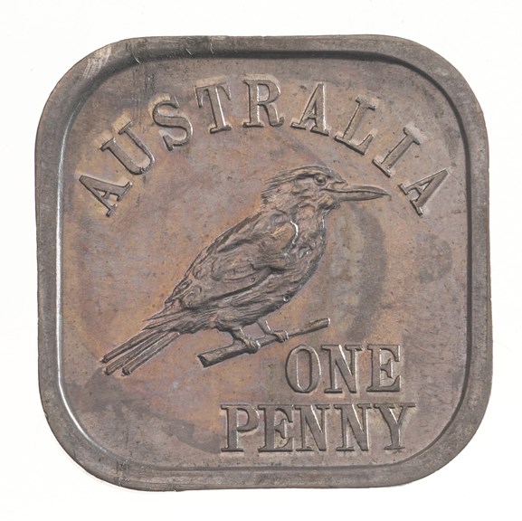 and image of a square shaped coin with the writing 'Australia, One Penny'