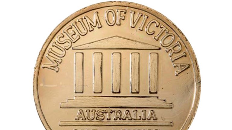 A commemorative coin with the text 'Museum of Victoria, Australia - Our living memory'