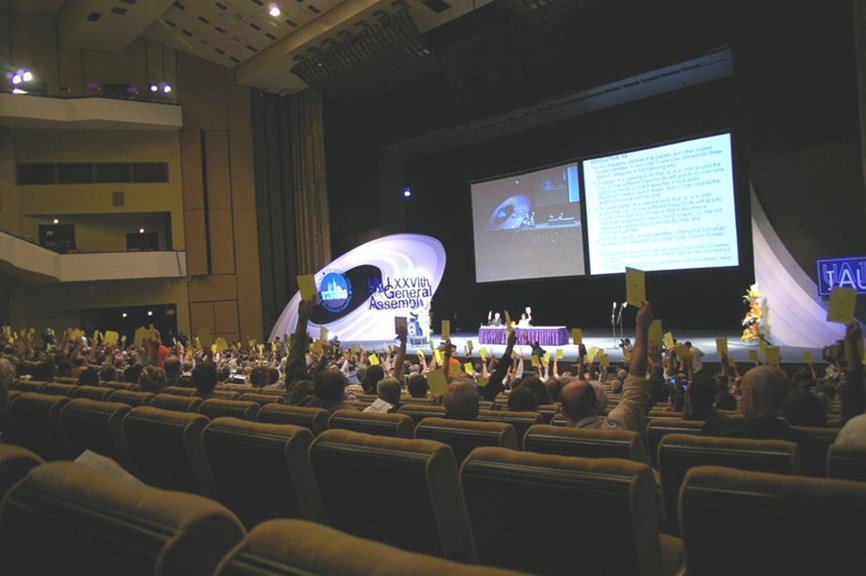 delegates voting at a conference