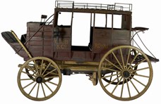 A horse-drawn passenger stage coach