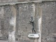 A bronze statue of Apollo as an archer