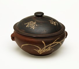 Clay pot steamer either brought to Australia or purchased in Australia by Sydney Louey Gung or his wife Yun Ping, early 1900s. It was used in traditional Chinese cooking to steam food by submerging the unglazed pot in water which absorbs and then releases moisture once heated.