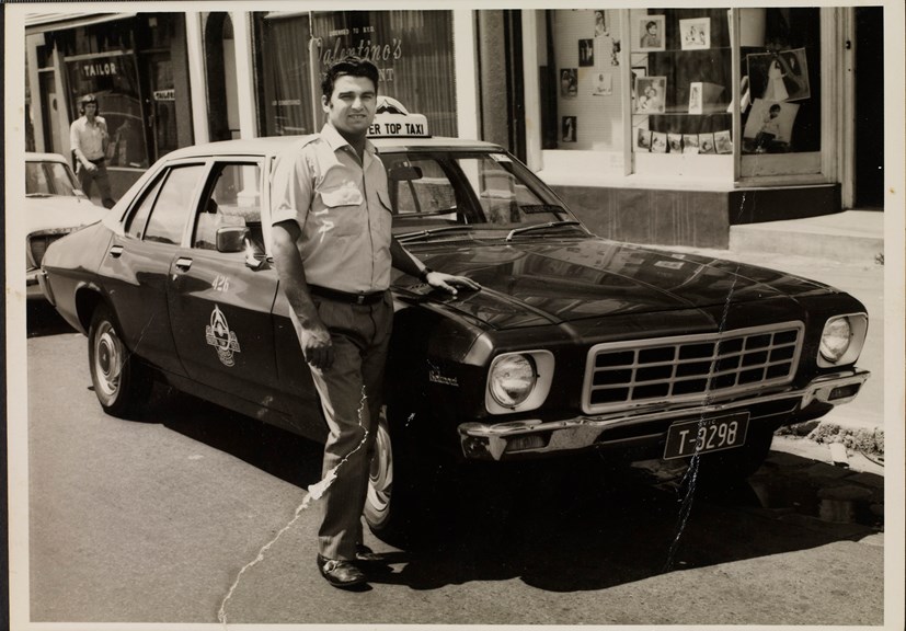 Portrait of taxi driver in front of the first taxi he drove, ca. 1972.