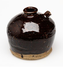 Glazed ceramic soy sauce jar.