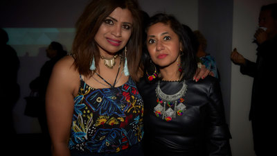  Two women wearing bright colours at the Diwali Up Late Festival at Immigration Museum