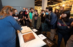 People learning about rare books at Melbourne Museum