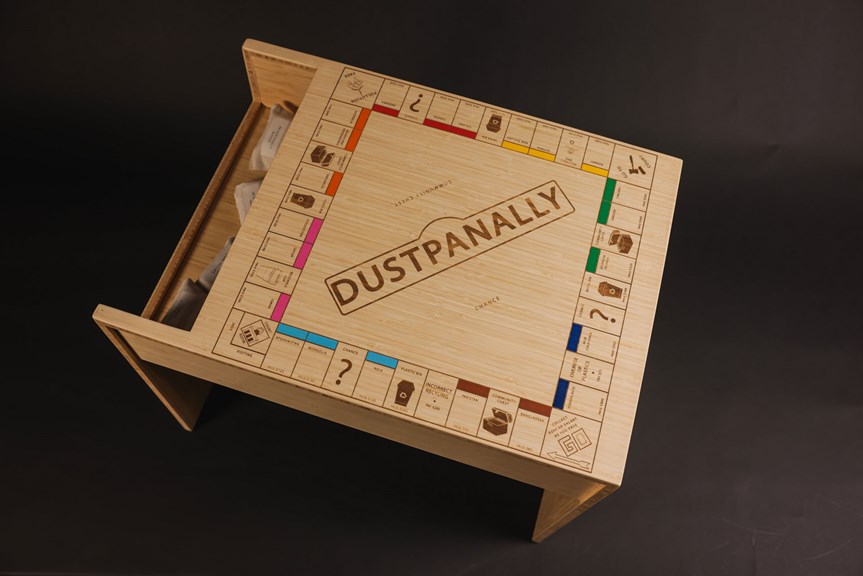 Wooden table that features an inbuilt tabletop board game called 'Dustpanally'.