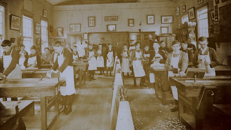 Old photograph of woodwork students in the classroom