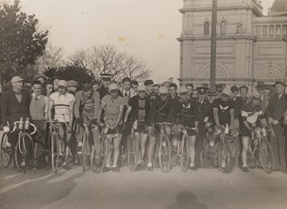 Group of Bicycle Riders with Exhibition Building in the background, Carlton, 1920s-1930s.
