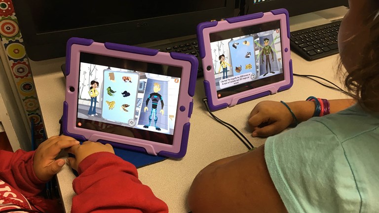 An iPad tablet displaying the ScratchJr app