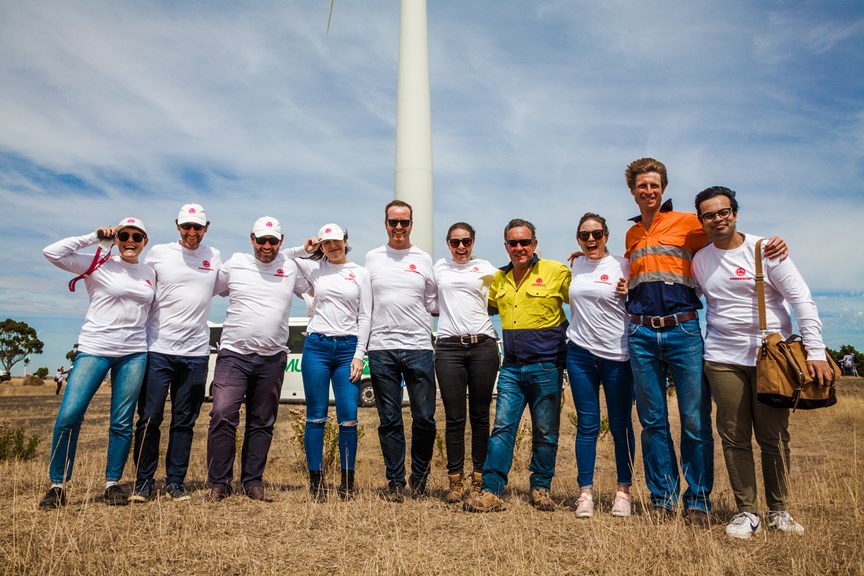 Group of Museum Members in front of a windmill during a field trip at a Mount Mercer windfarm, organised by Powershop.
