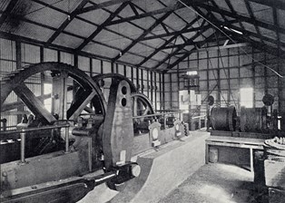 Interior view of engine house showing mining pumping equipment.