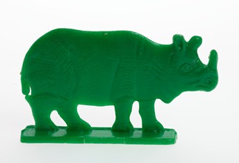 Green plastic toy rhinoceros. 