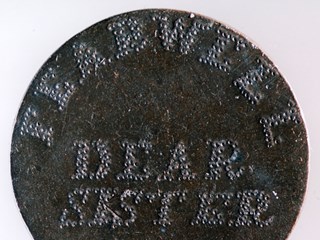 A love token engraved on the reverse of a 1797 British penny (36 mm).