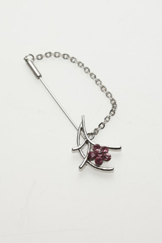 Silver brooch with pink crystals