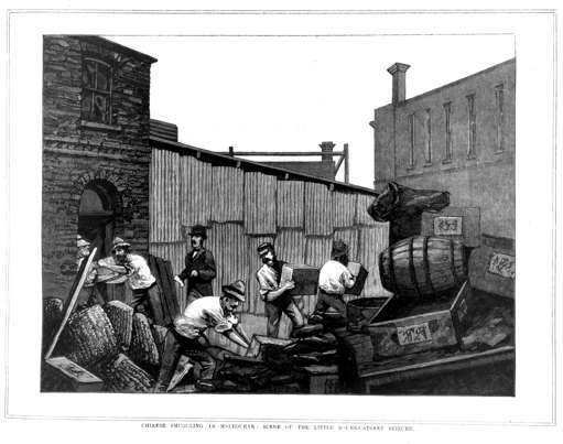 Men seizing cargo marked with Chinese writing