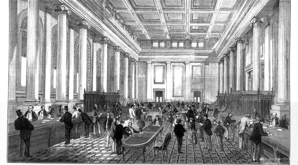 Men at desks and tables in grand hall