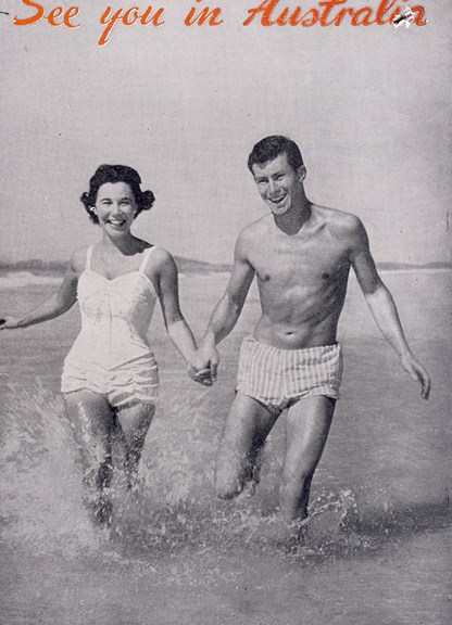 Assisted passages to Australia poster, "See you in Australia", 1963, in which a woman and a man hold hands as they run merrily in water up to their shins.