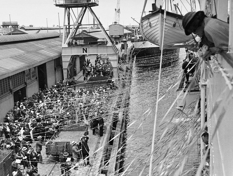 Crowd with streamers farewelling a ship at Fremantle, 1934