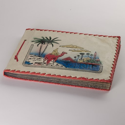 Leather bound scrap book purchased in Port Said and used on a voyage from England, 1961.