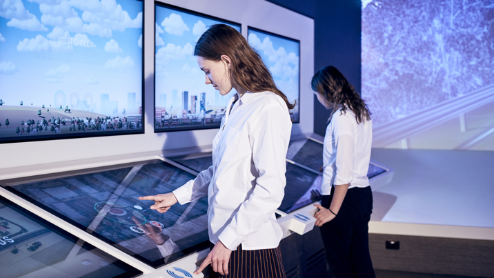 Student using the interactive touch displays. 