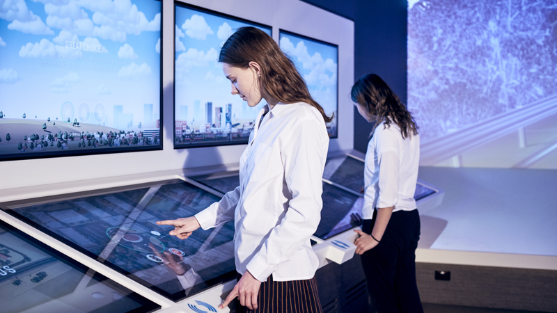 Student using the interactive touch displays. 