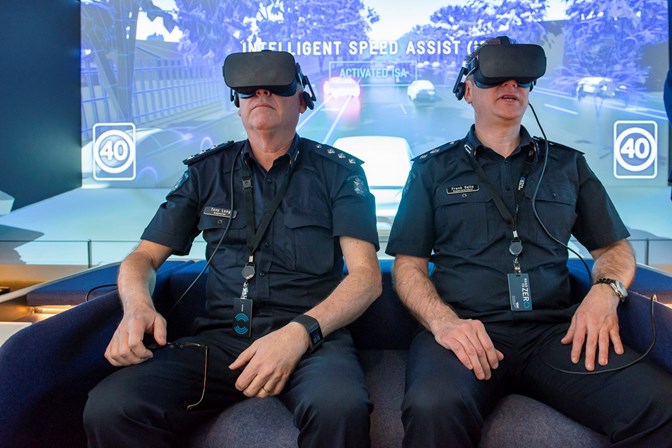 Two police officers with VR headsets on