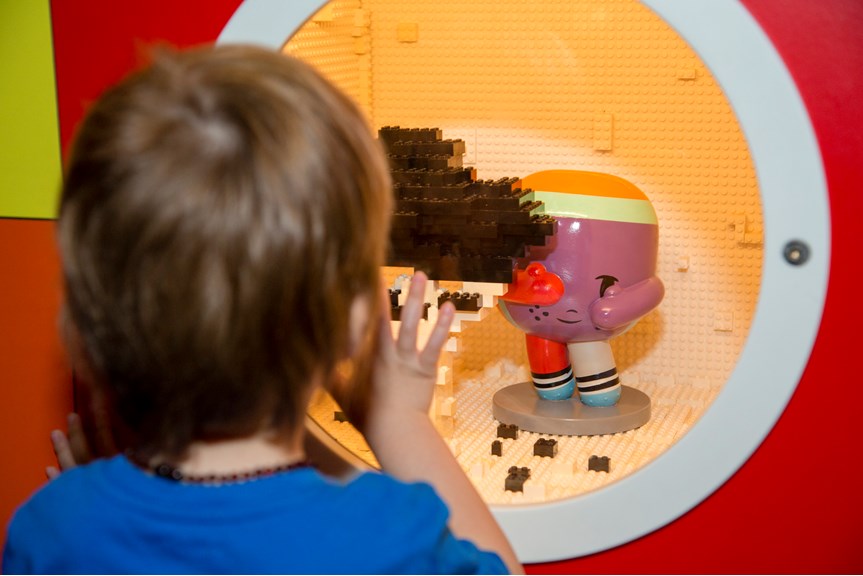 Boy looking for Dotty in Ground Up exhibition at Scienceworks.