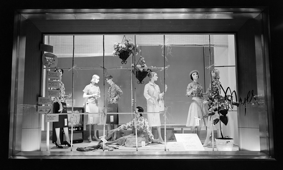 Display window at Myer department store showing advertising signs, decorations and seven female mannequins dressed in clothes by Terylene.